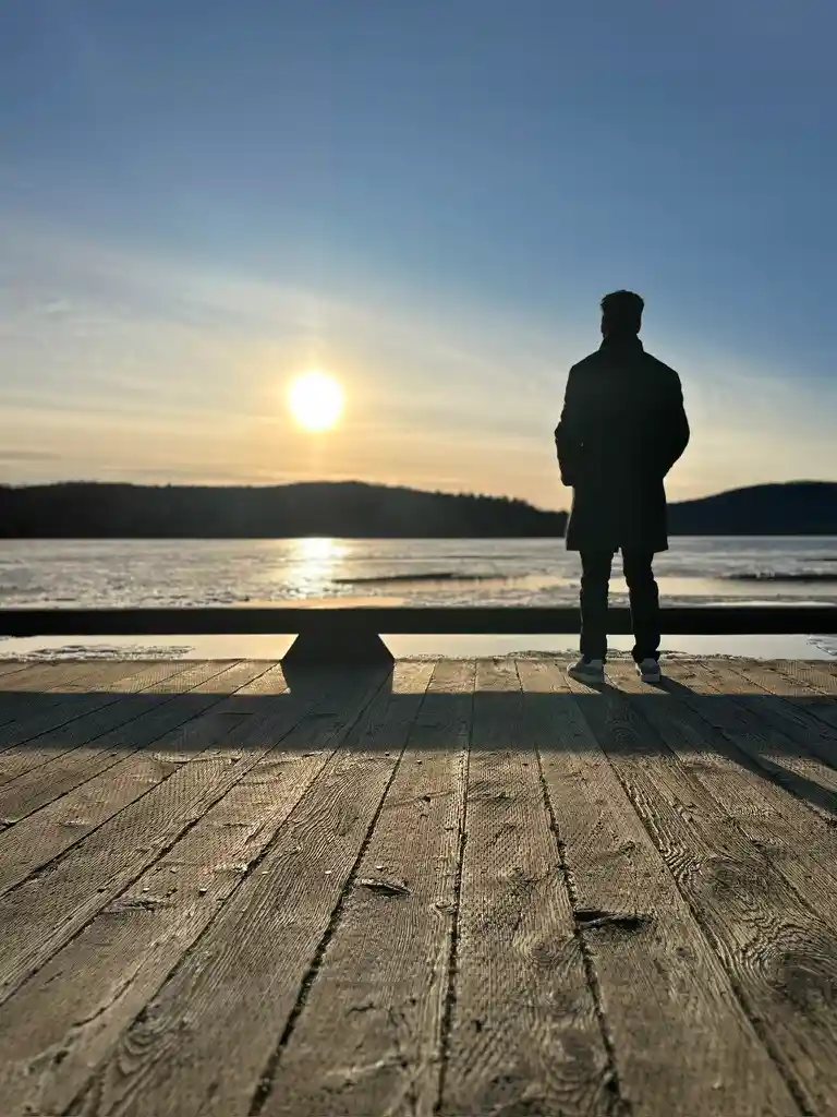 Sunrise silhouette on a wooden pier